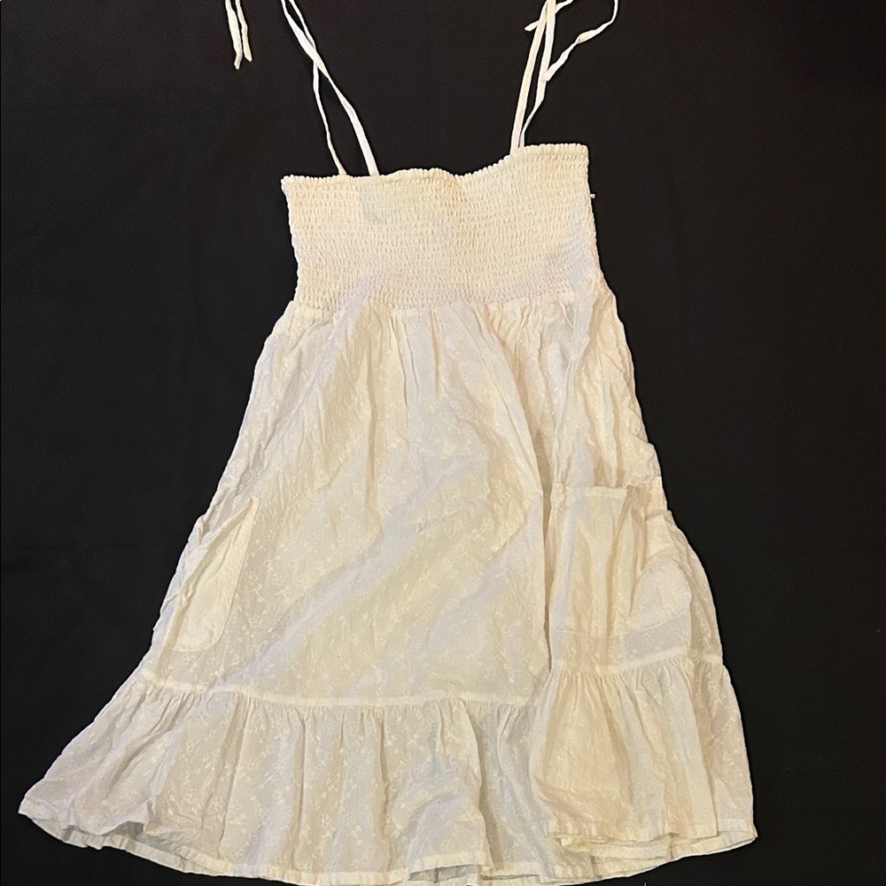 White Sleeveless Dress with Ruffle Hem
